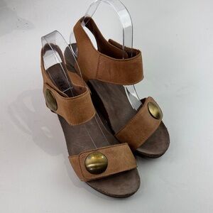 taos tan leather wedge sandal with gold medallion detail